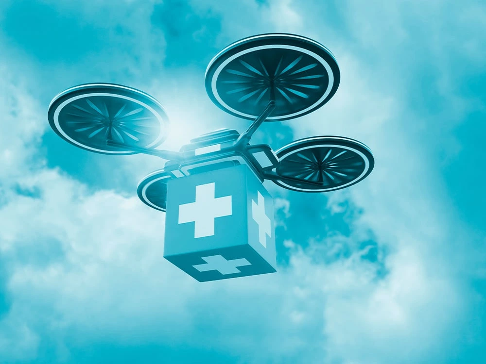 Imagen de un dron futurista cargando un contenedor de medicamentos 